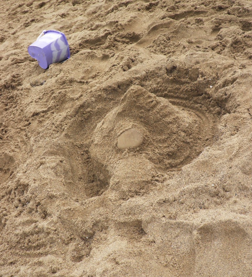 Sandcastle with stone