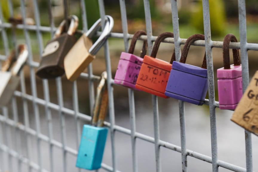 Many coloured padlocks on the Wharfe Bridge at Otley