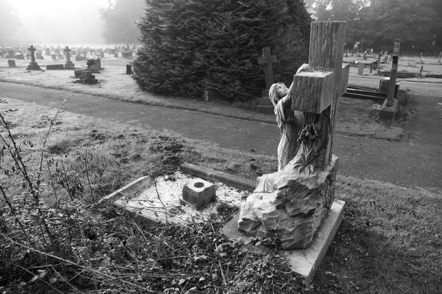 Woman at Cross gravestone