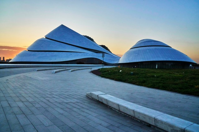 Sunset behind Harbin Grand Theatre