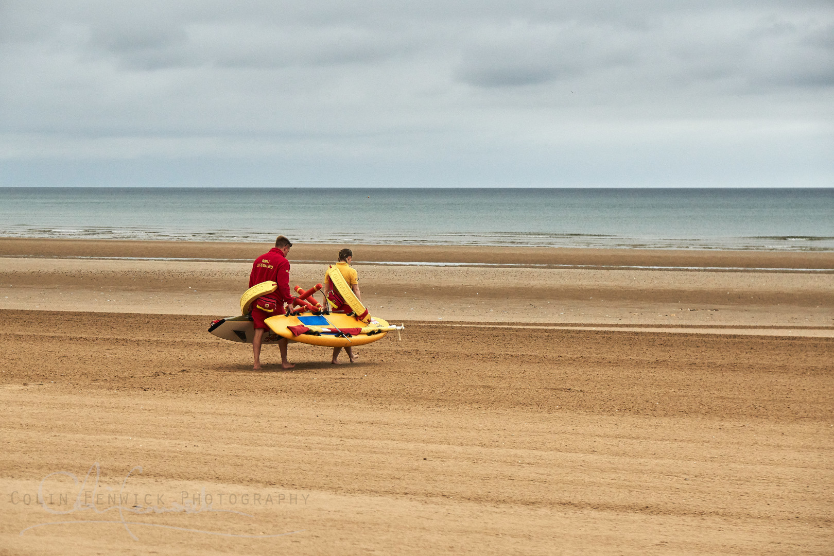 Lifegaurds walking on the beach
