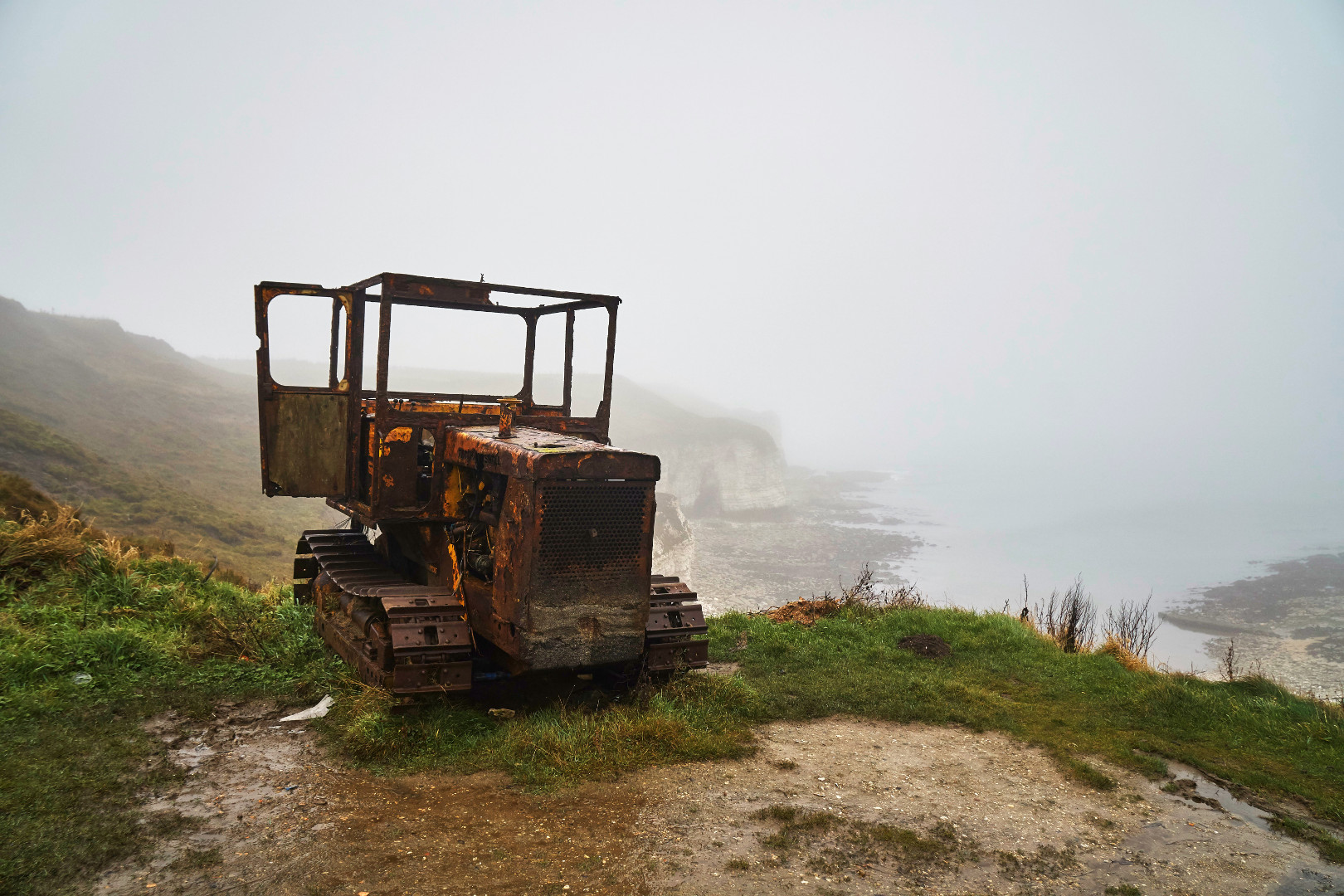 Abandoned tractor on a cliff