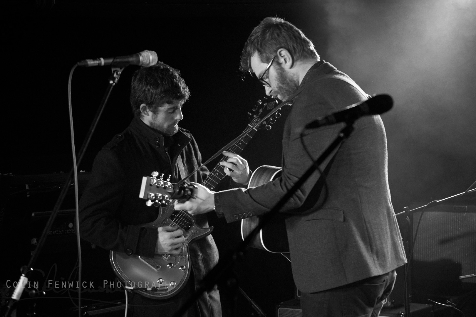 Two guitar p[layers on stage