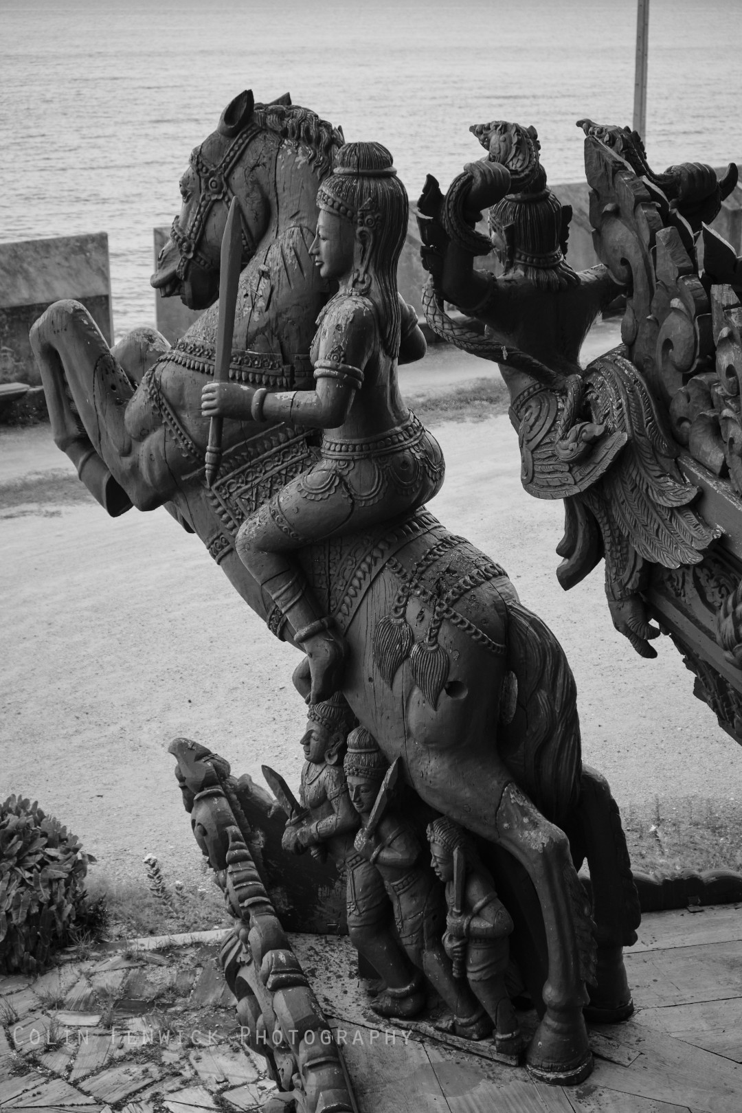 Figure riding wooden horse