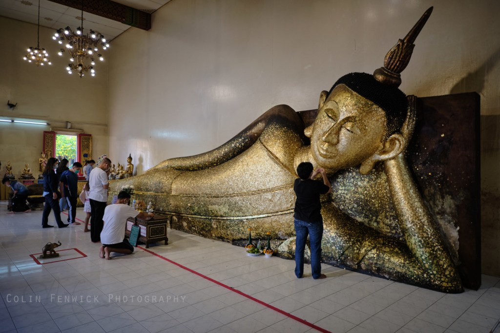 Left leaning Buddha statue