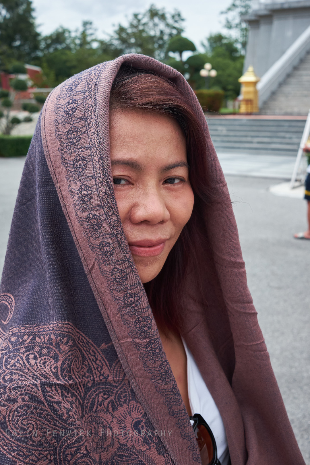 Head and shoulders portrait of a woman wearing Thai scarf