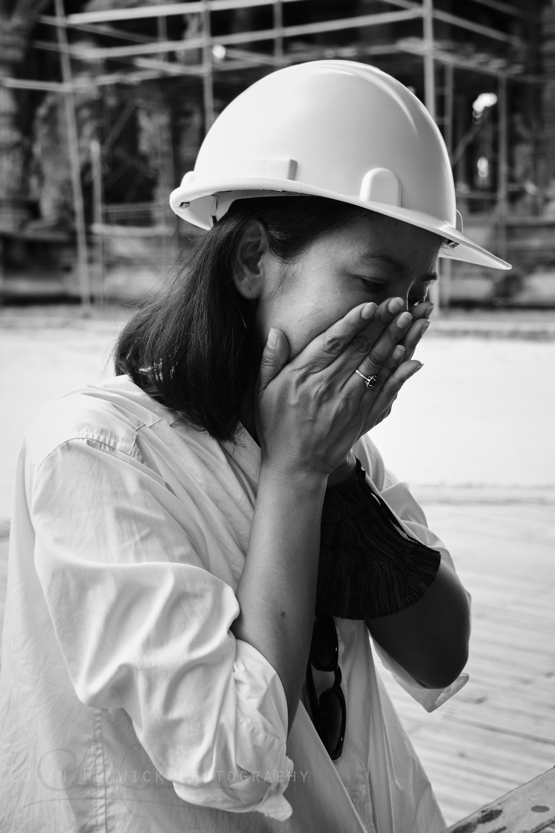 woman in a hard hat sat down