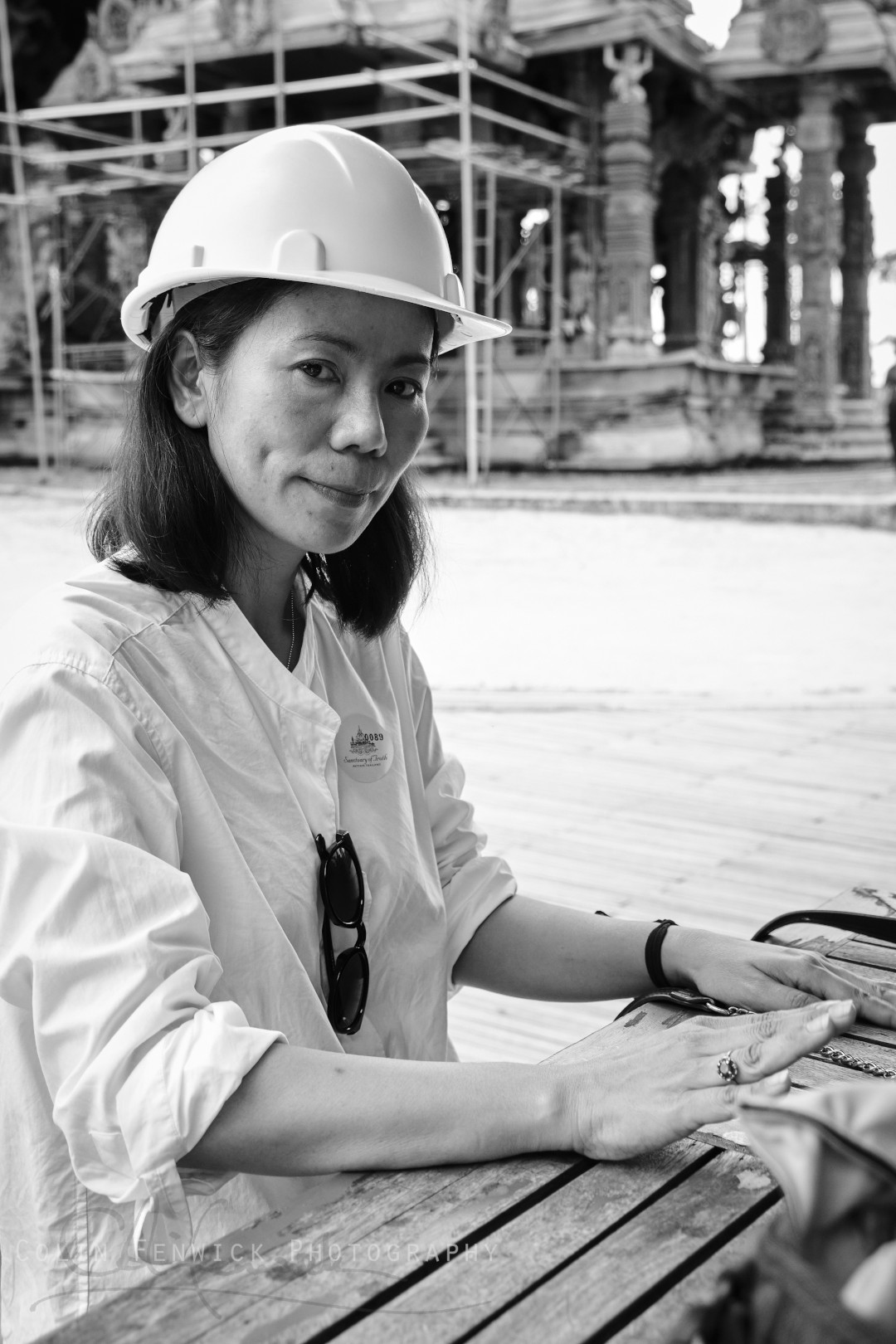 woman in a hard hat sat down