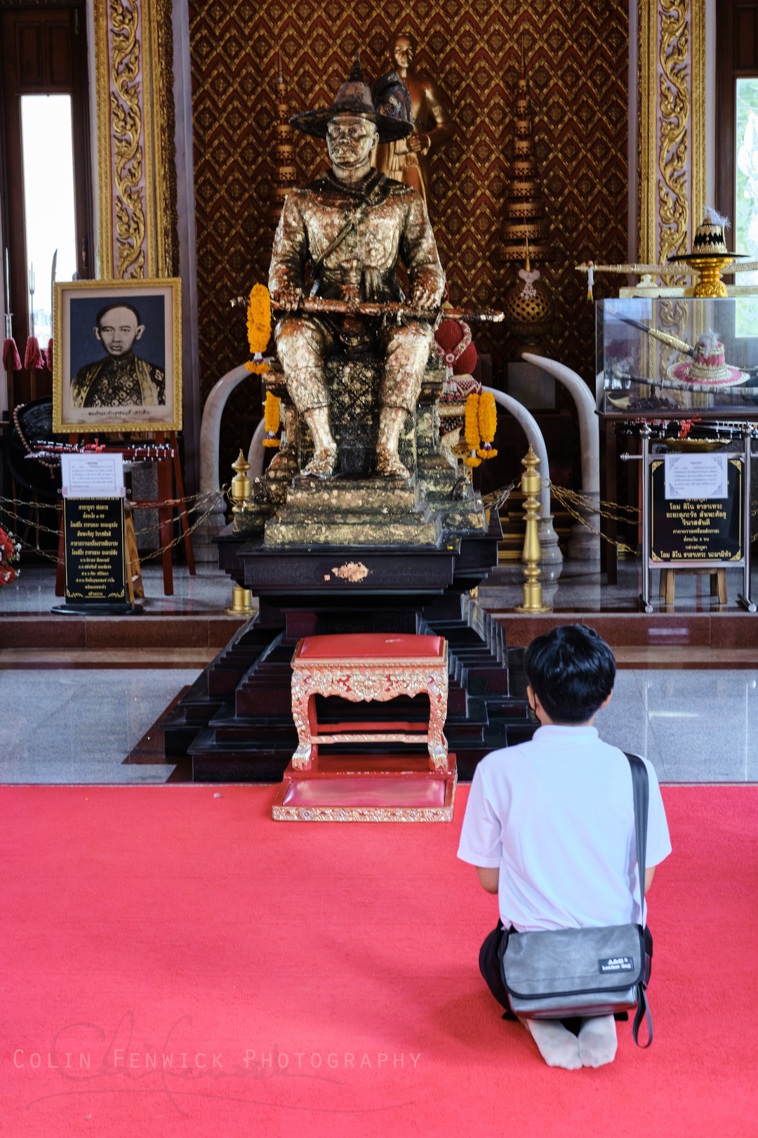 A man prays at the Taksin Shrin in Rayong