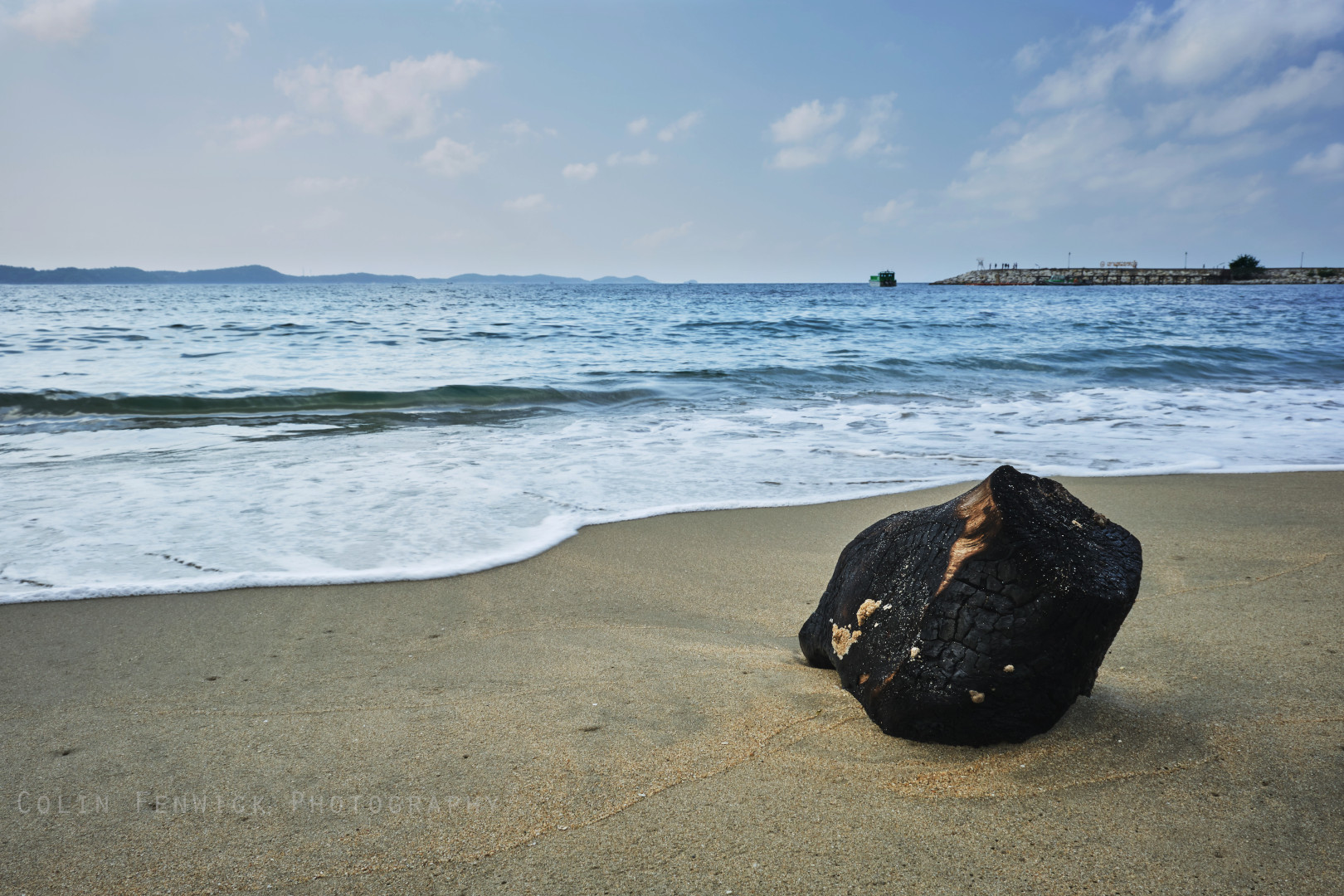 Burned driftwood on the beach