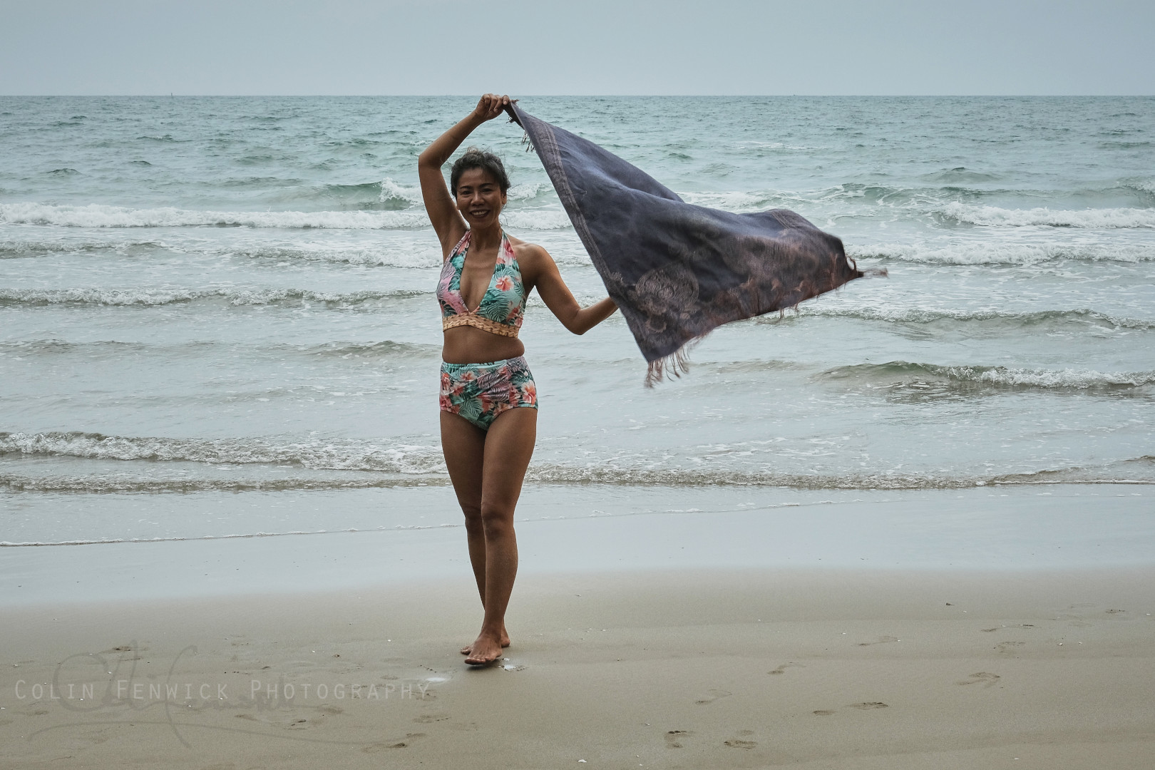 Woman with scarf on a beach