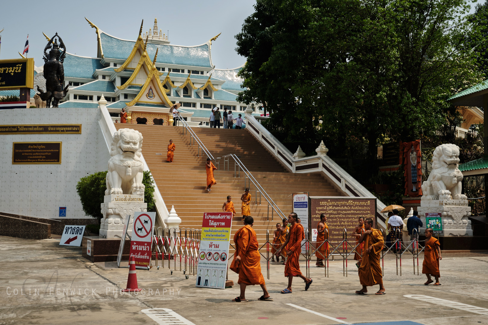 Monks exiting temple site at Wat Pa Phu Kon in Udon Thani Thailand
