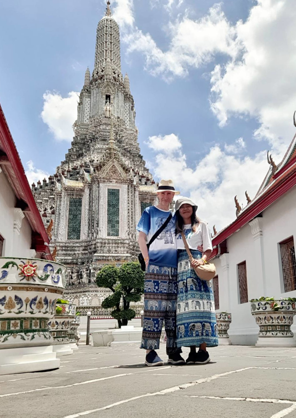 Couple standing in front of Wat Arun