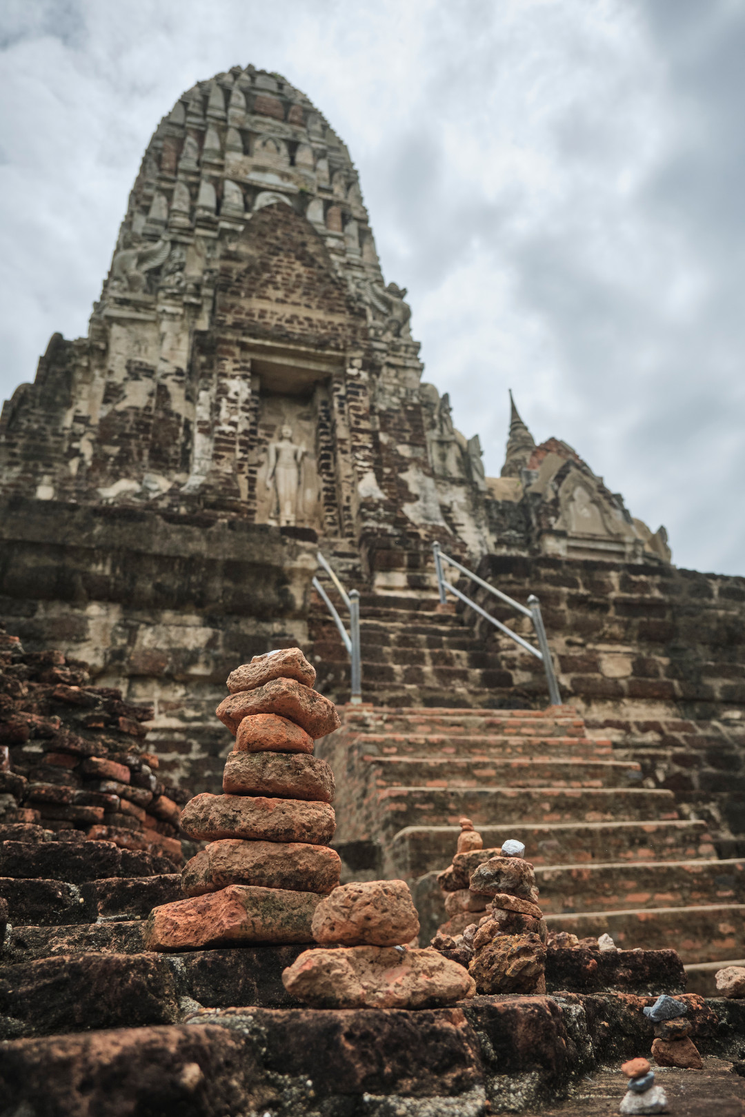 Small piles of stones in front of the main prang at Wat Ratchburana