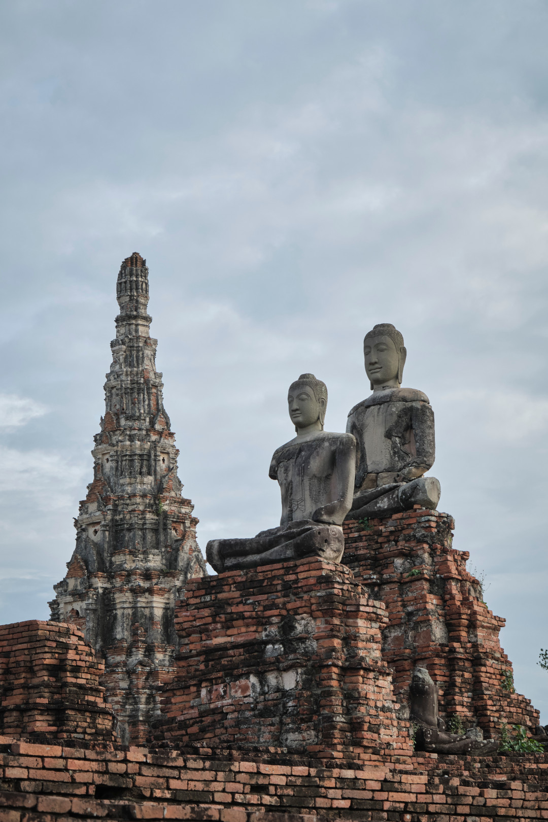 Two elevated Buddha statues